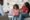 Black girl teenager crying during therapy session with child psychologist